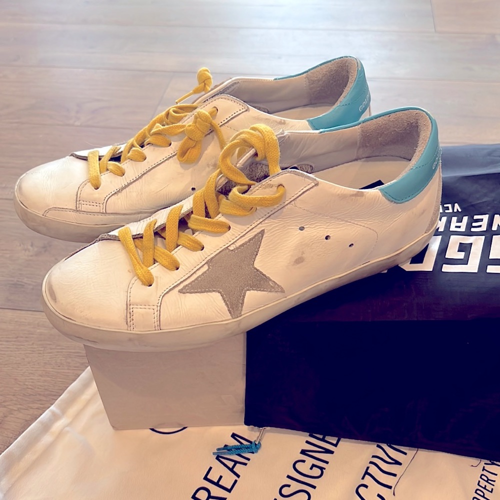 Authentic Golden Goose Sneakers with original packaging.